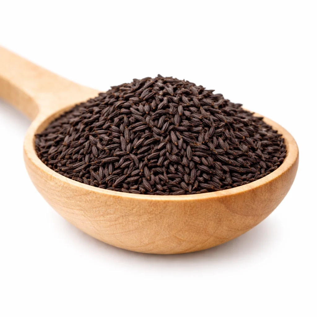 Premium quality black shahi jeera seeds in a wooden spoon isolated on pure white background, high-resolution HDR product image.